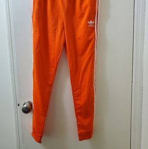 Orange adidas trackpants